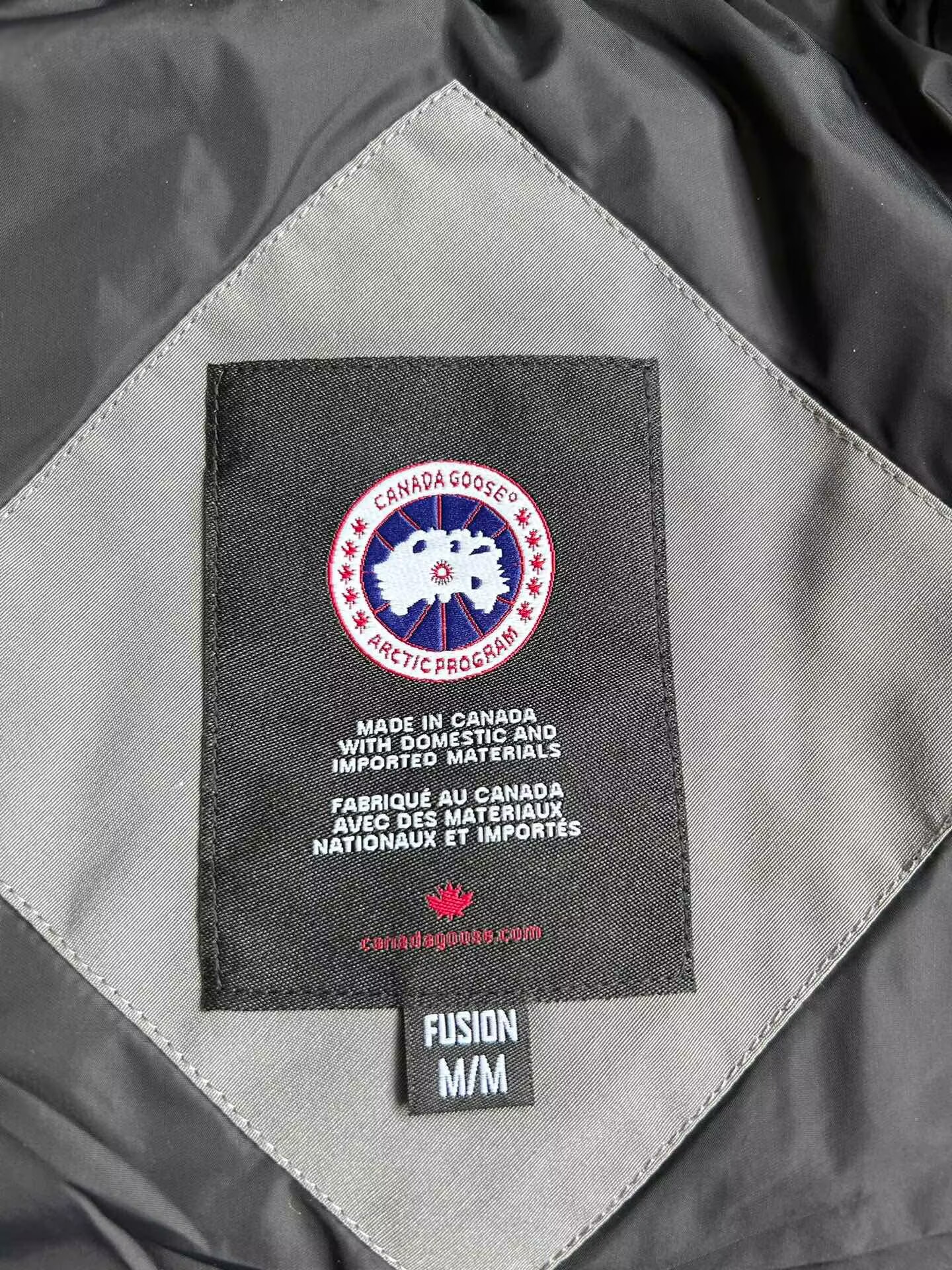 Can*a Go*e coat-250